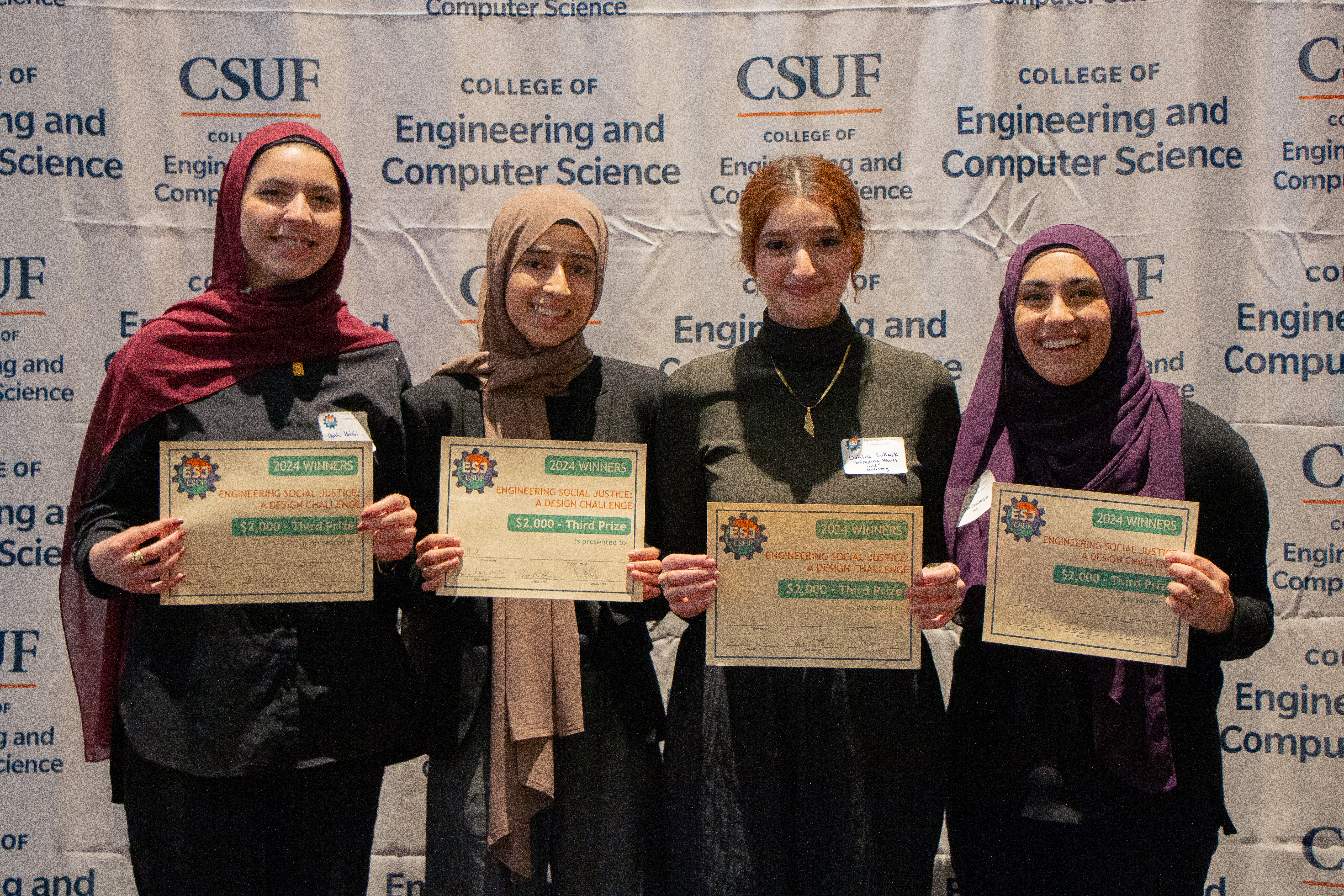 Defending Hearts and Harmony Team holding up their award!