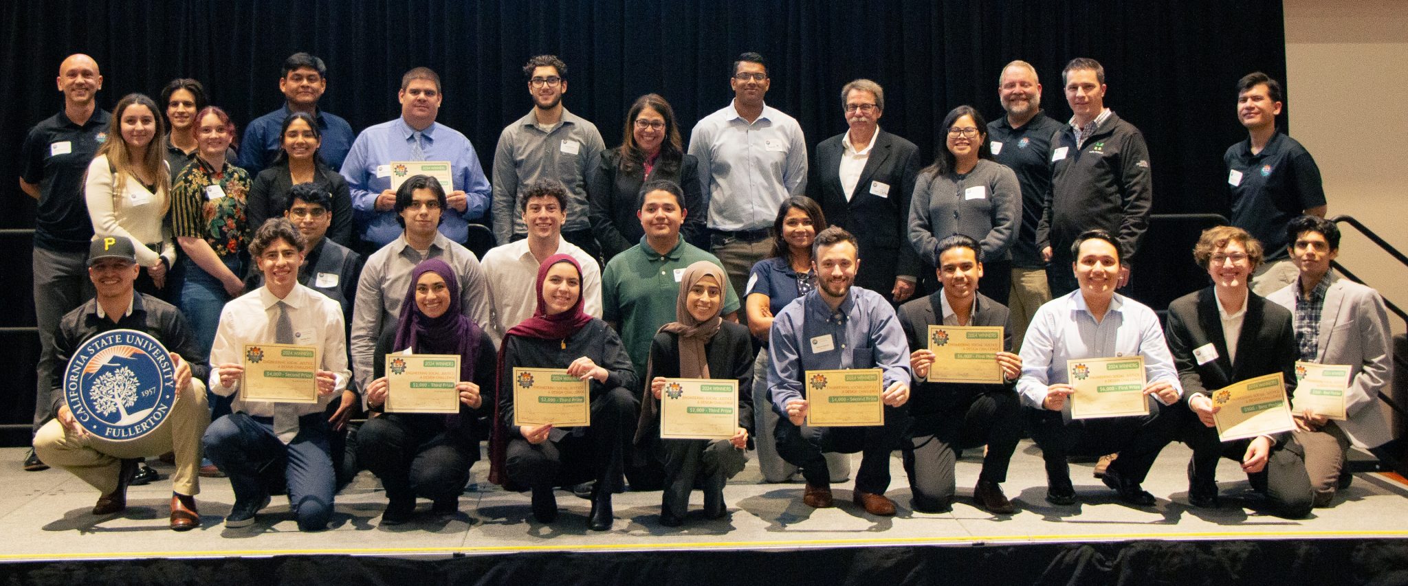 ESJ 2024 Participants gathered onstage for a group photo.